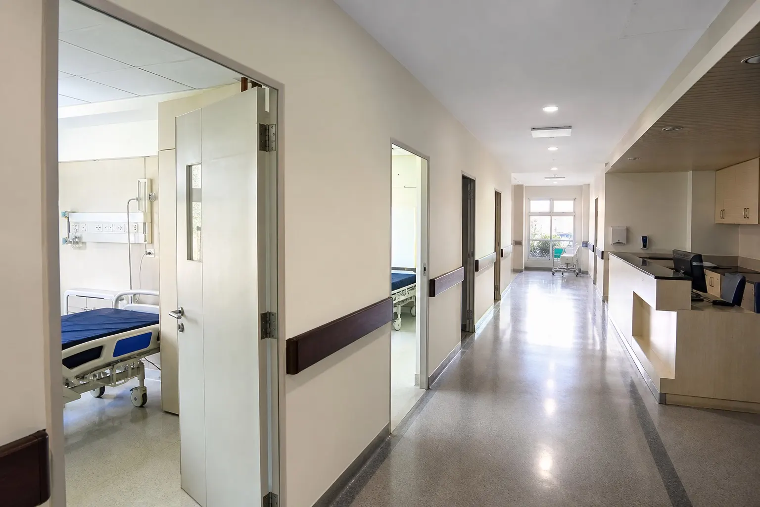 Clean modern hospital ward corridor with natural daylight